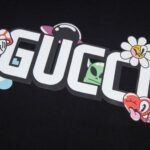 Gucci Graphic T-shirt with Cartoon Black Logo - Image 4